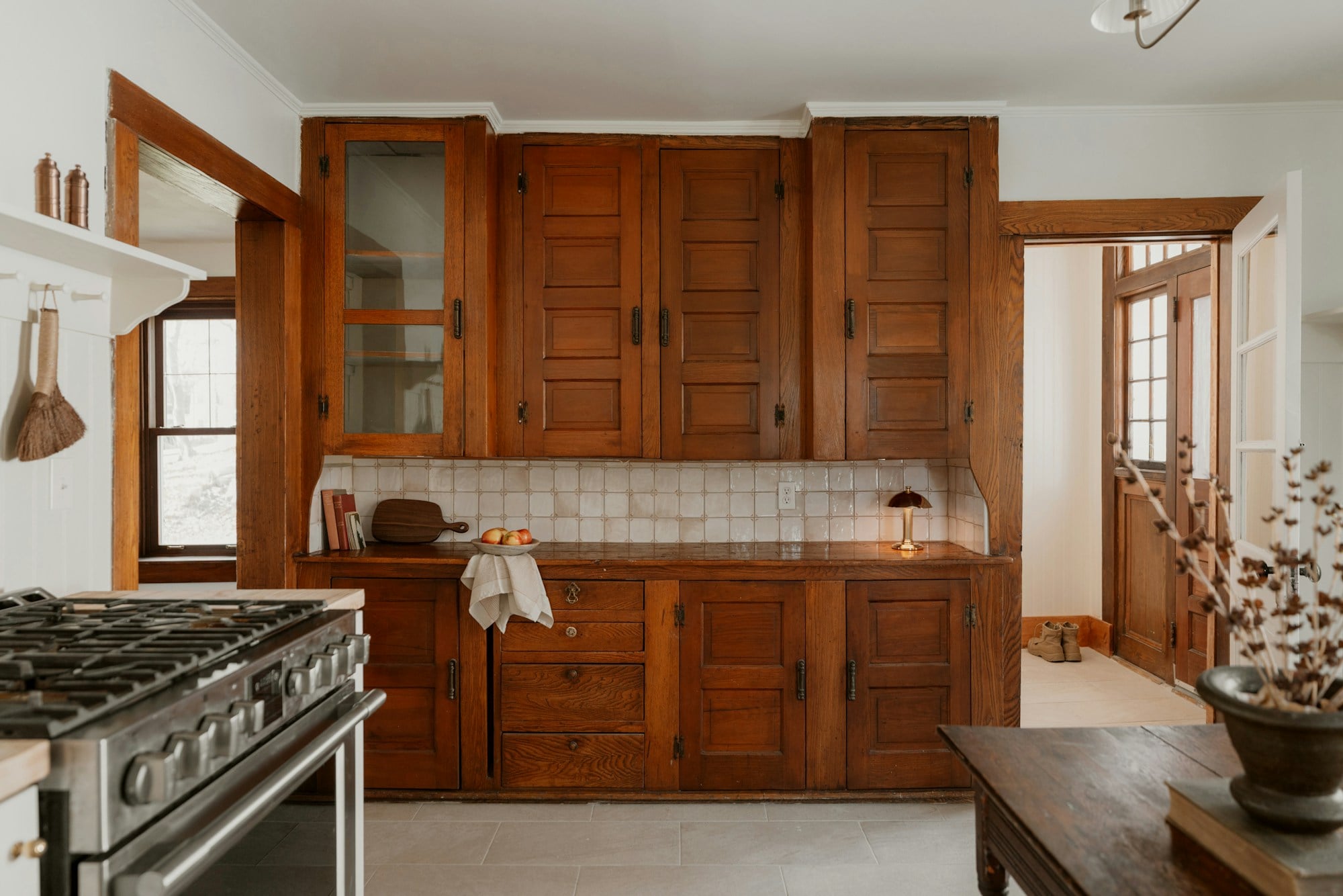 Wooden kitchen cabinets and a tiled backsplash
