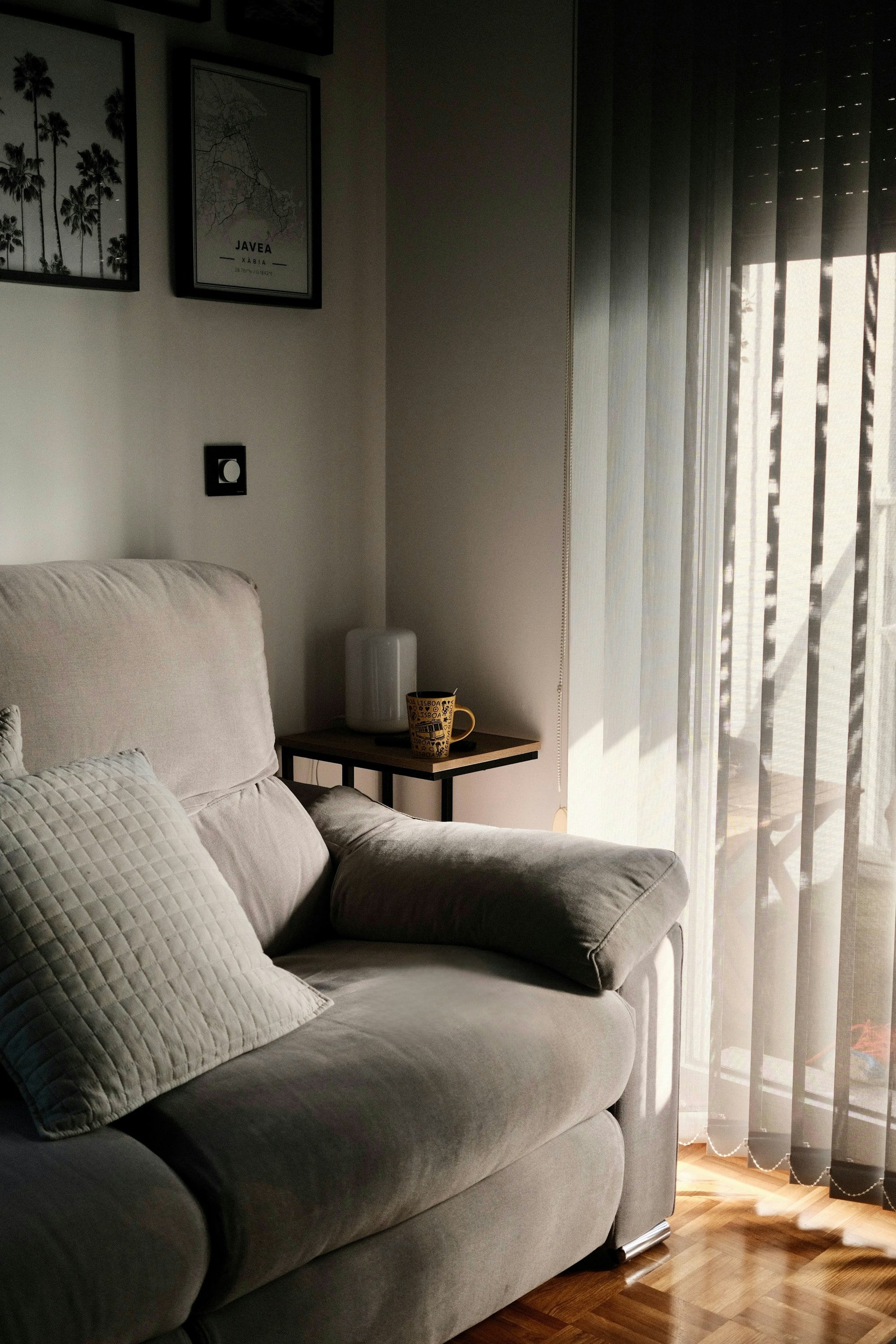 Soft window light falling on a sofa